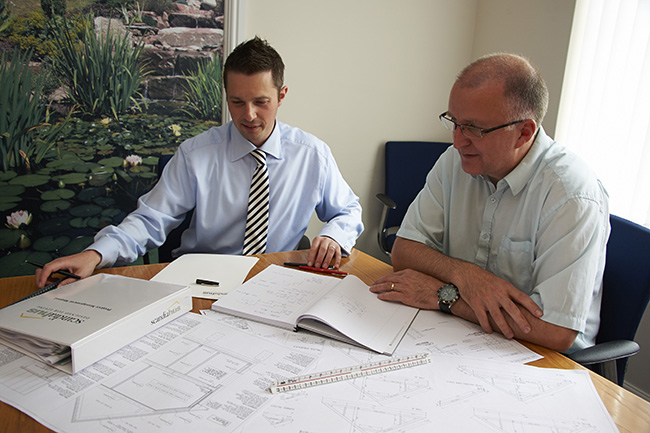 Southern BCP surveyors at a plans meeting
